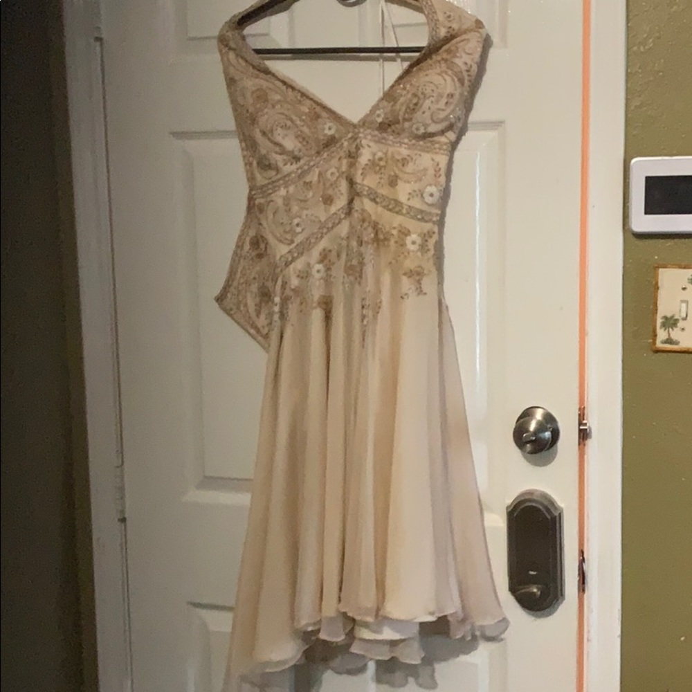 Beaded mini dress. Halter back, low neck front.